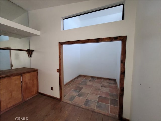 interior space with dark wood-type flooring