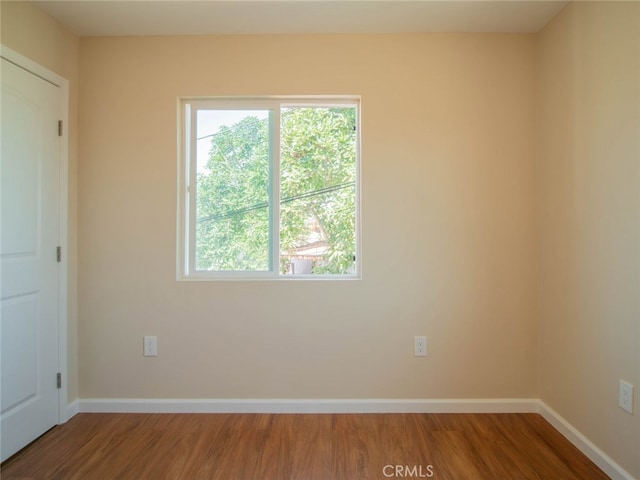 empty room featuring hardwood / wood-style floors