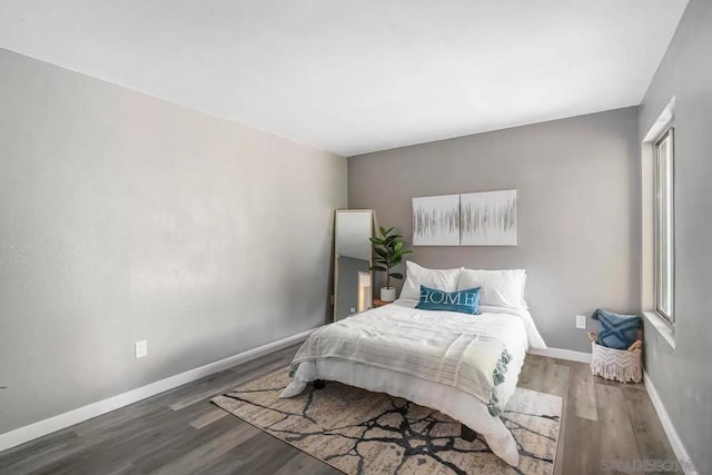 bedroom with wood-type flooring