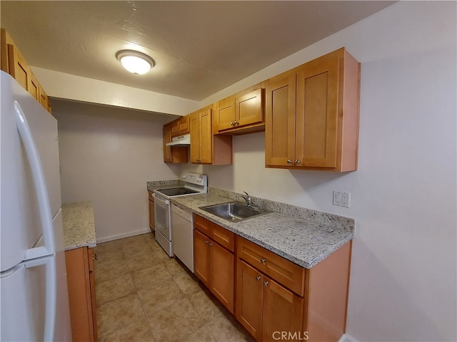 kitchen featuring sink, white appliances, light tile flooring, and light stone counters