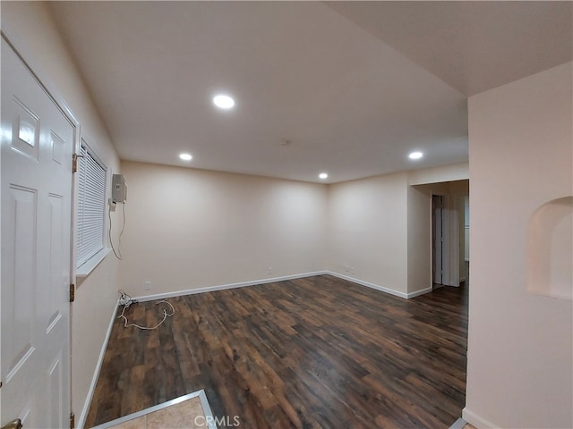 spare room with wood-type flooring