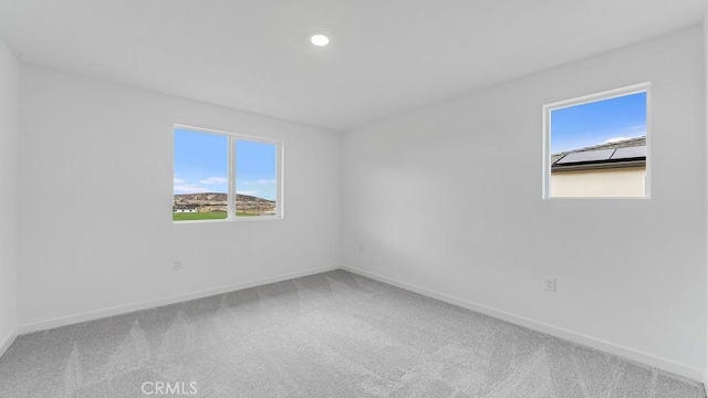 empty room featuring carpet floors