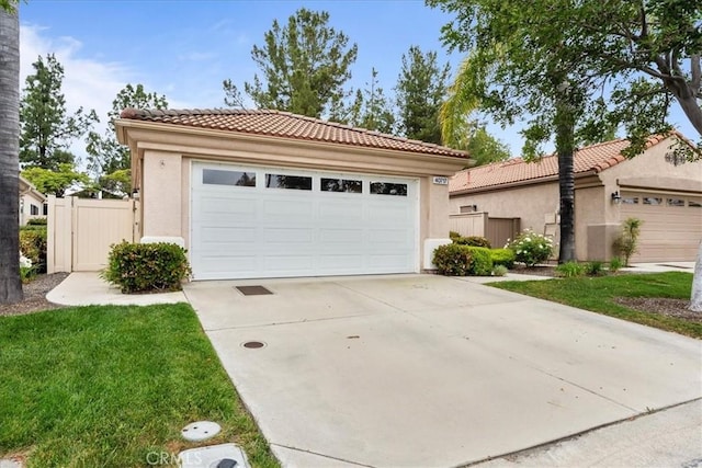 garage with fence and a gate