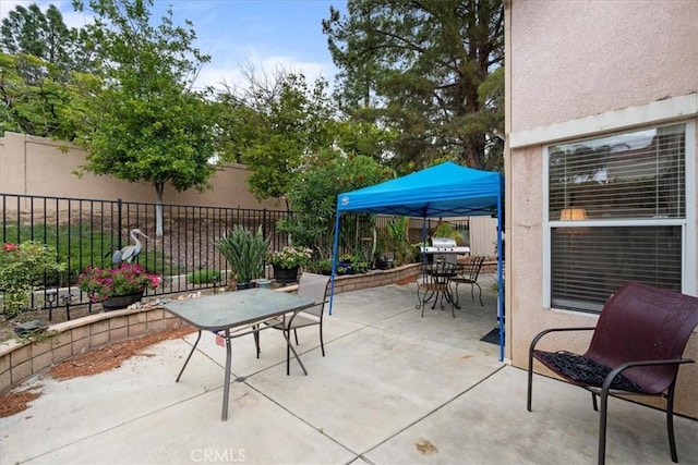 view of patio / terrace featuring outdoor dining space and fence