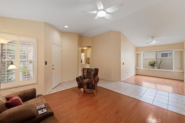 tiled living area featuring recessed lighting and ceiling fan