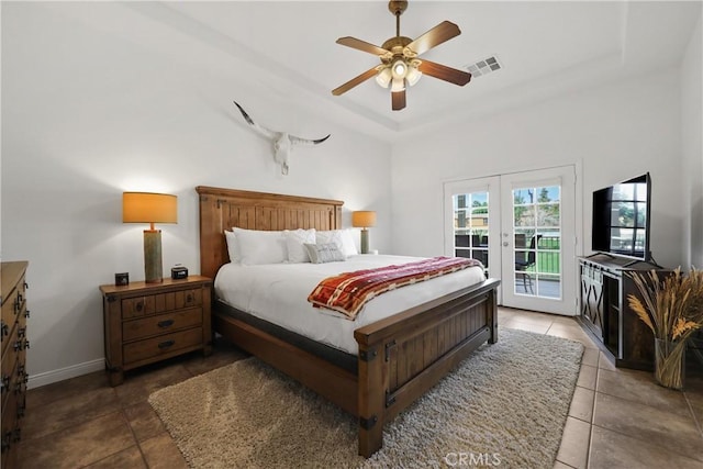 tiled bedroom featuring access to exterior, french doors, and ceiling fan