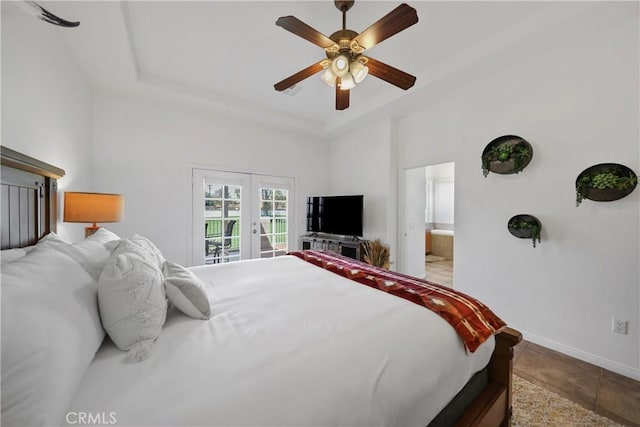 bedroom with ensuite bathroom, ceiling fan, light tile patterned flooring, and french doors