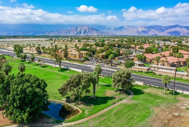 aerial view featuring a water and mountain view