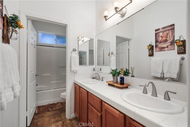 full bathroom featuring shower / bath combination with glass door, vanity, and toilet