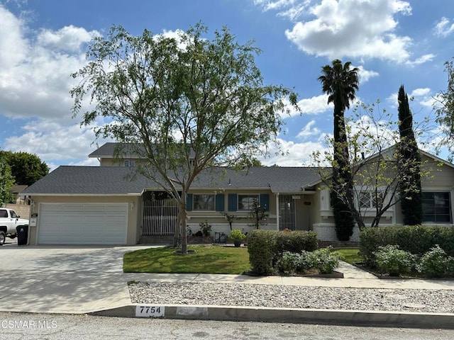 ranch-style home featuring a garage