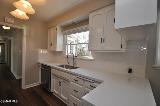 kitchen featuring white cabinets, dark hardwood / wood-style flooring, dishwasher, and tasteful backsplash