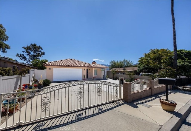 mediterranean / spanish home featuring a garage