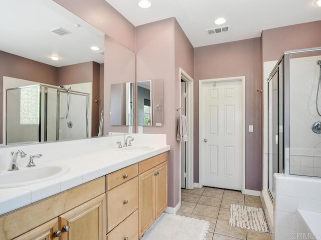 bathroom with vanity, plus walk in shower, and tile patterned flooring