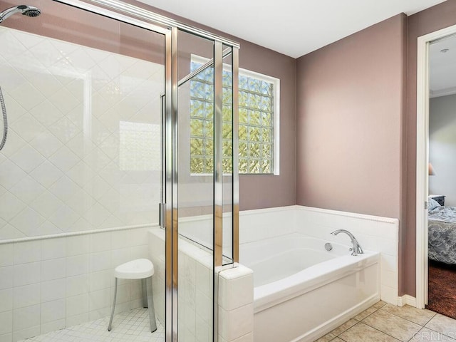 bathroom featuring tile patterned floors and plus walk in shower