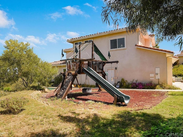 view of jungle gym with a lawn