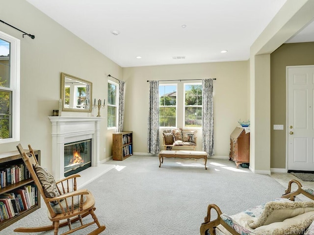 living area with light colored carpet