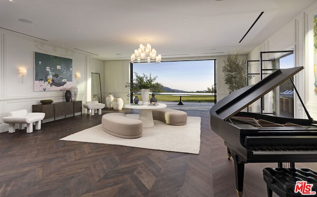 sitting room with a notable chandelier and dark parquet floors