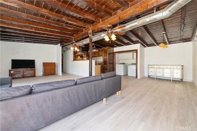 living room with wood ceiling, ceiling fan, hardwood / wood-style floors, beamed ceiling, and independent washer and dryer