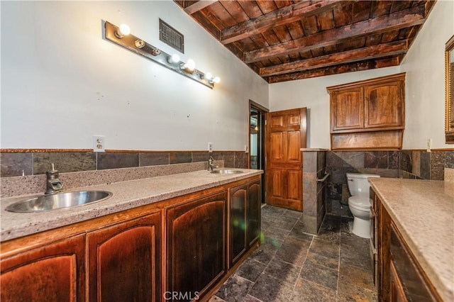 bathroom featuring vanity, toilet, tile walls, beam ceiling, and wood ceiling