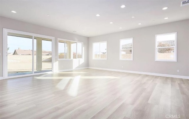 unfurnished room with light hardwood / wood-style floors