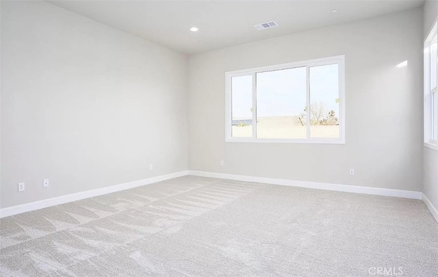 spare room with light carpet