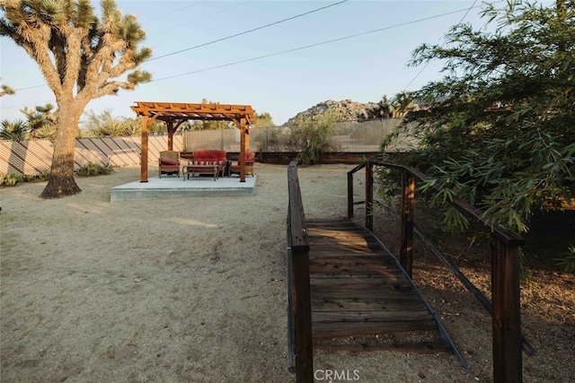 exterior space featuring a fenced backyard, a pergola, and a patio area