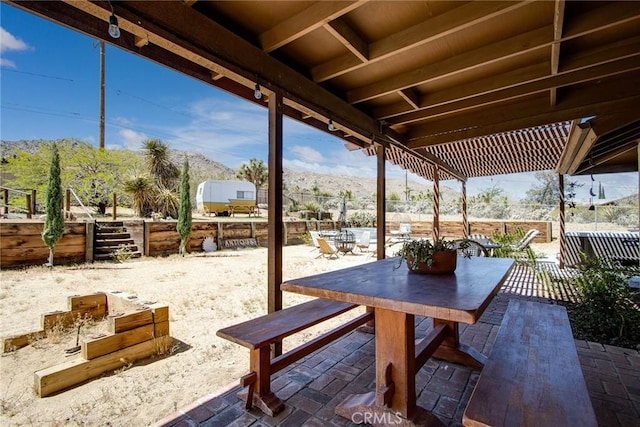 view of patio / terrace featuring fence and outdoor dining space