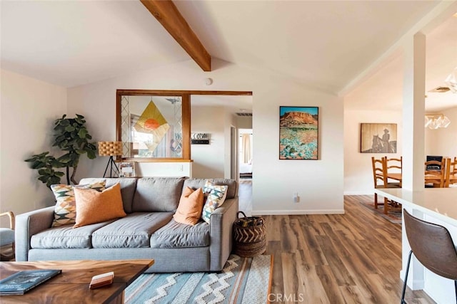 living room with wood-type flooring and vaulted ceiling with beams