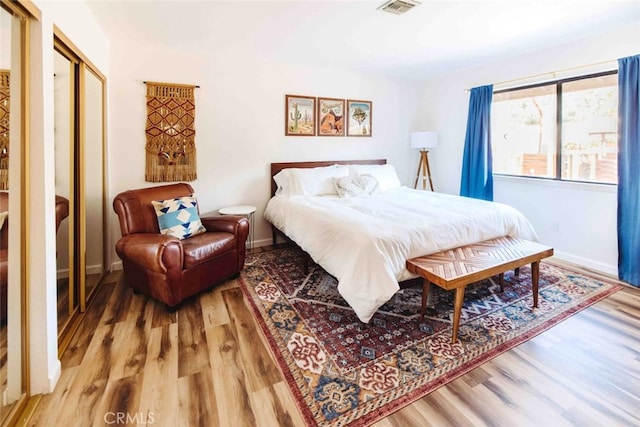 bedroom featuring a closet and wood-type flooring