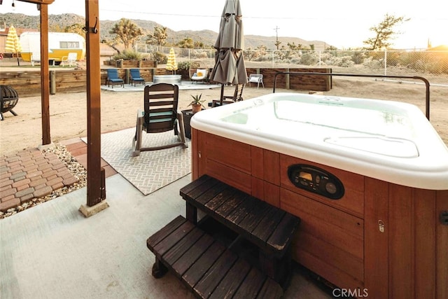 exterior space featuring a hot tub