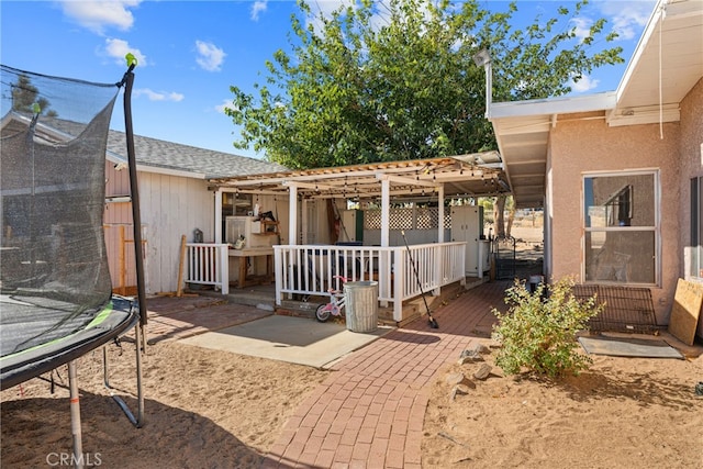 exterior space featuring a patio area and a trampoline