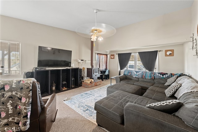 carpeted living room featuring ceiling fan