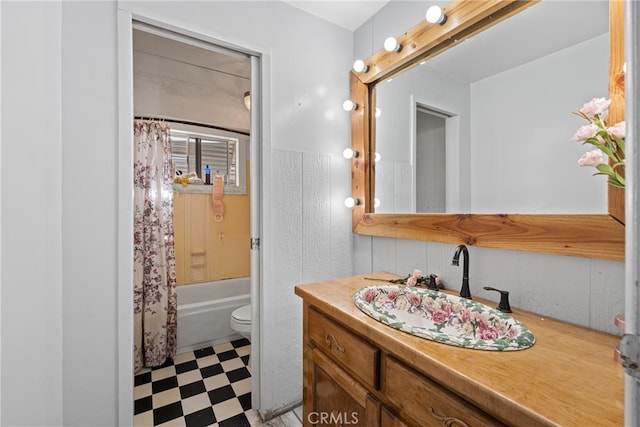 full bathroom featuring vanity, toilet, and shower / tub combo