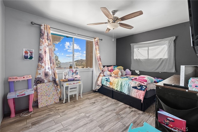 bedroom featuring ceiling fan and light hardwood / wood-style floors