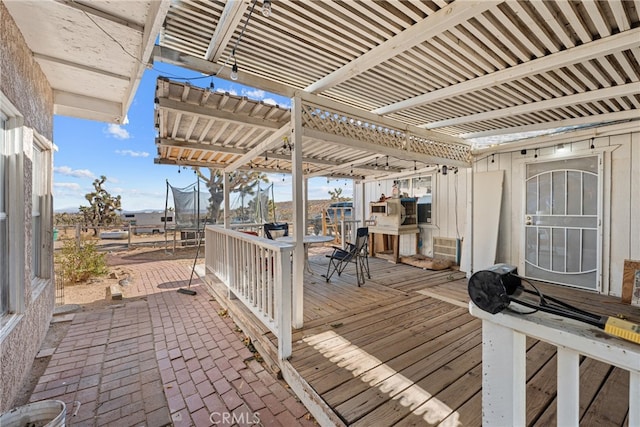 deck featuring a patio area and a pergola