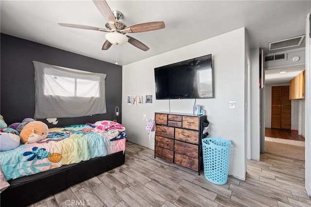 bedroom featuring ceiling fan and light wood-type flooring