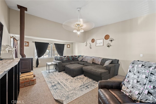 living room with vaulted ceiling, light colored carpet, and ceiling fan