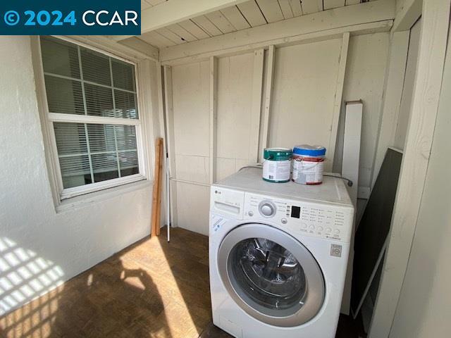 clothes washing area with washer / clothes dryer