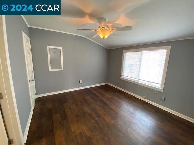 unfurnished room featuring wood-type flooring, ceiling fan, and crown molding