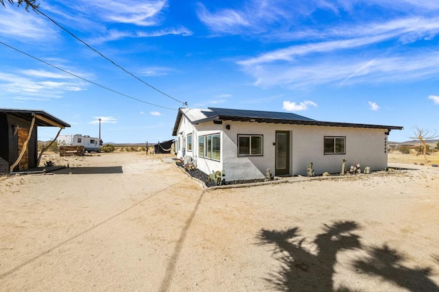 view of front of house with solar panels