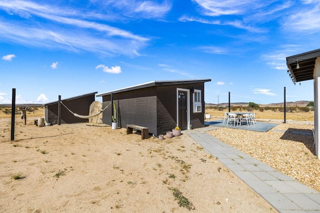 exterior space with a patio area