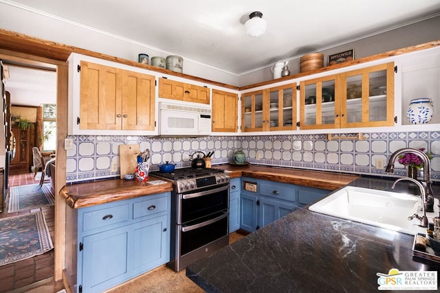 kitchen featuring sink, tasteful backsplash, and stainless steel range with gas stovetop