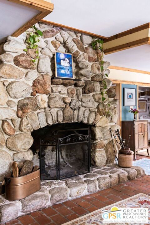 interior details with a fireplace and crown molding