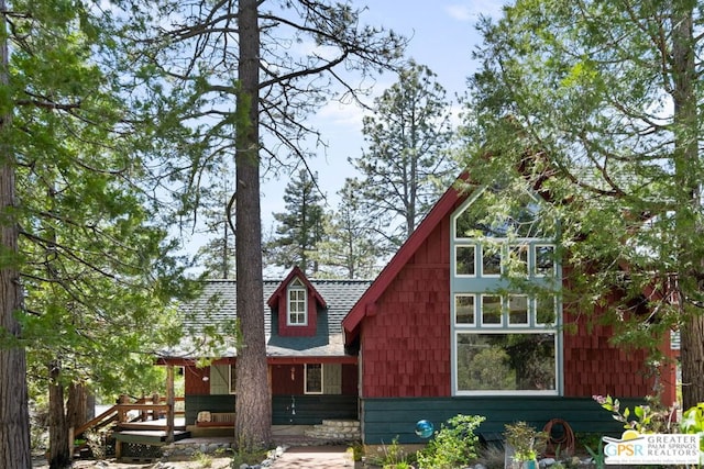 view of side of home featuring a wooden deck