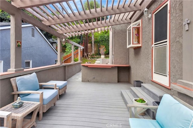 wooden terrace with a pergola