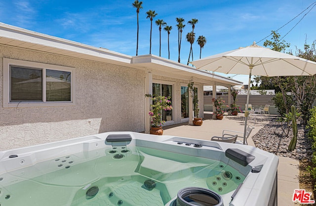 view of patio / terrace featuring a hot tub