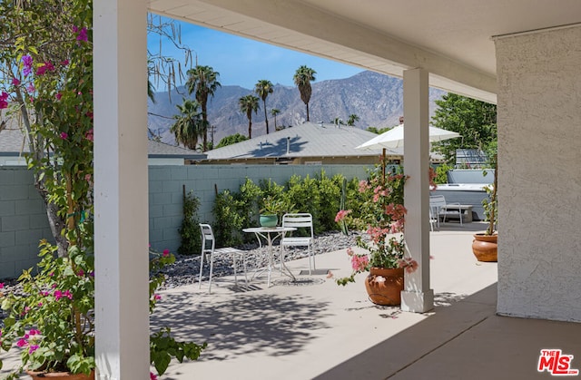 view of patio / terrace featuring a mountain view