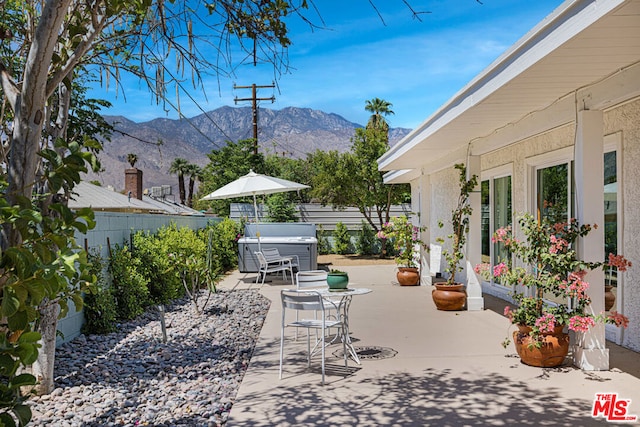 view of patio / terrace featuring a mountain view