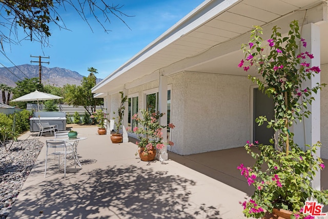 view of patio / terrace with a mountain view