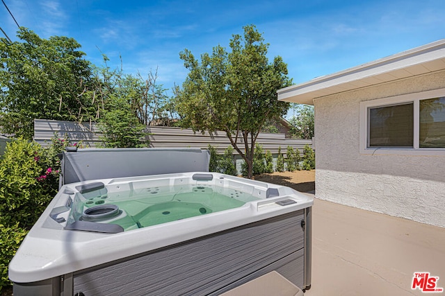 view of patio with a hot tub